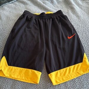 Nike Men's Black Shorts with Yellow Trim Orange swoosh